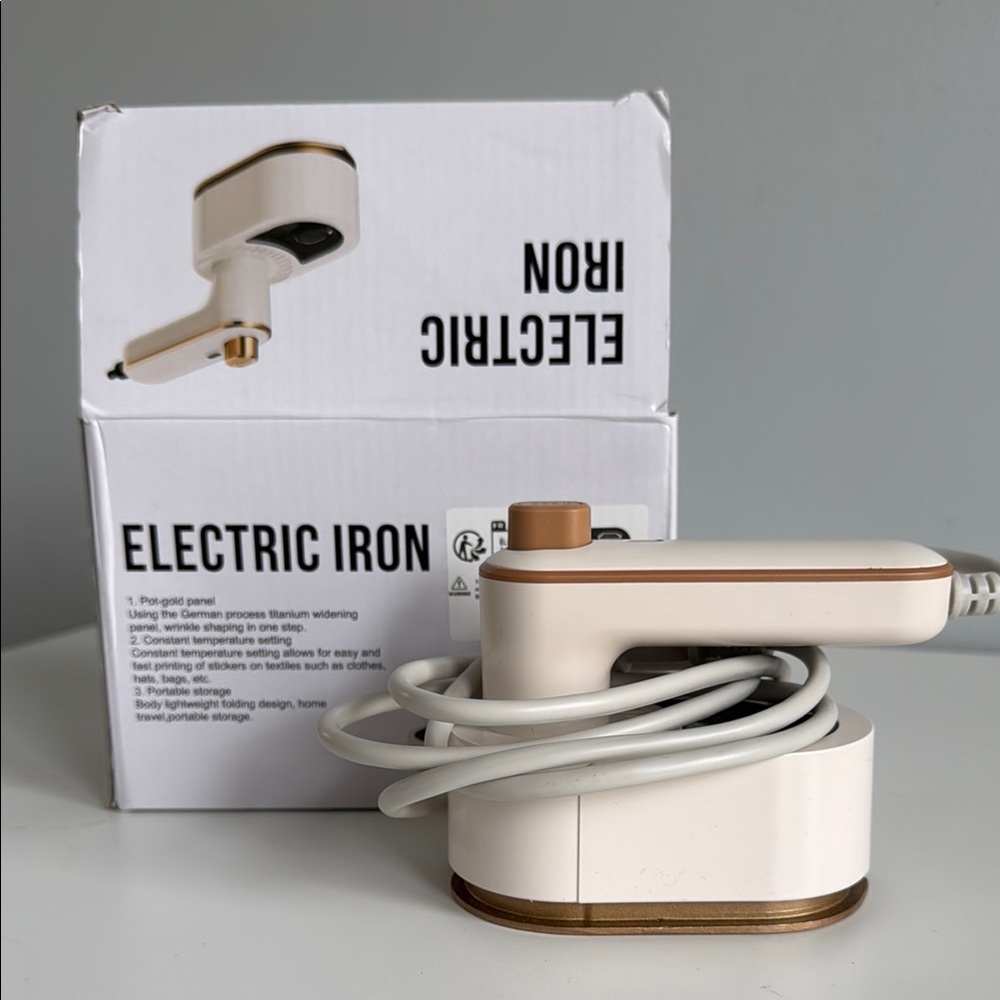Compact White and Gold Electric Iron